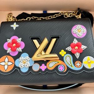 Louis Vuitton authentic Black Epi Leather Limited
Edition Flower Twist Bag